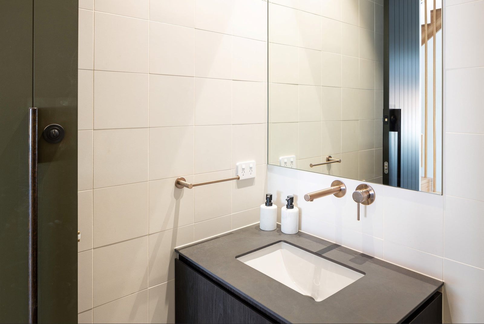 Meir Round Guest Towel Rail - Champagne in a bathroom