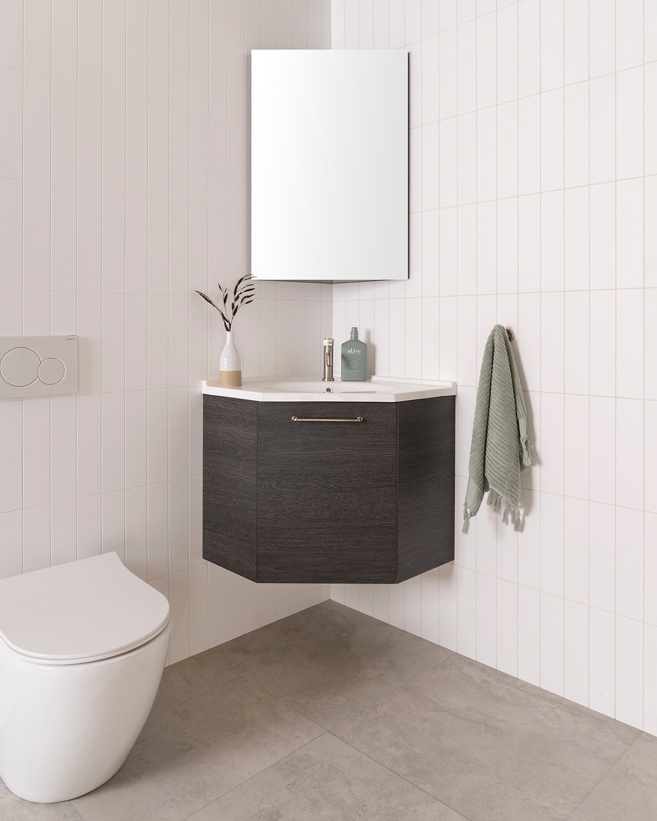 Glacier Corner Vanity, 600x600, Wall Hung. Estella Oak Woodmatt textured cabinet finish with Brushed Nickel Stirling handle. Cast Marble Moulded top. Glacier Corner Mirrored cabinet.