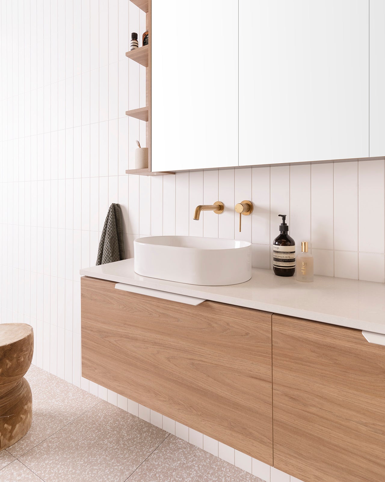 ADP Glacier vanity: Patty Above-Counter Basin. Matte White Blaze Handles. Brushed Brass Soul Groove Wall Mixer and Wall Spout.