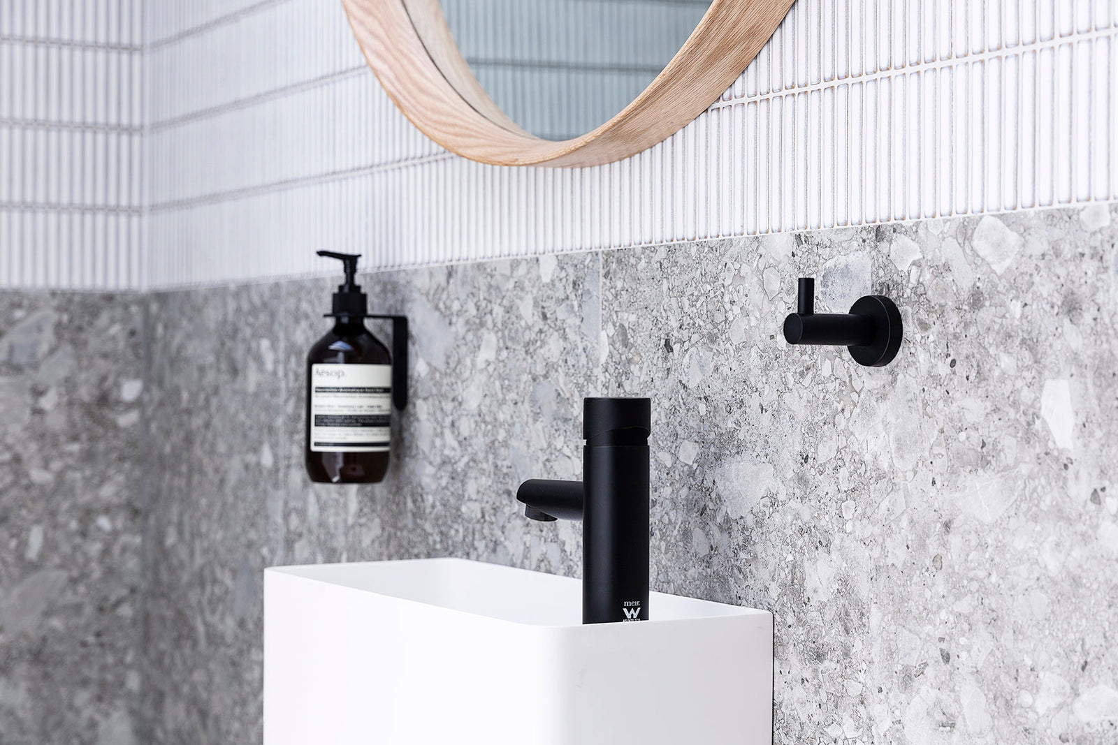 Meir Round Pinless Basin Mixer - Matte Black in a bathroom