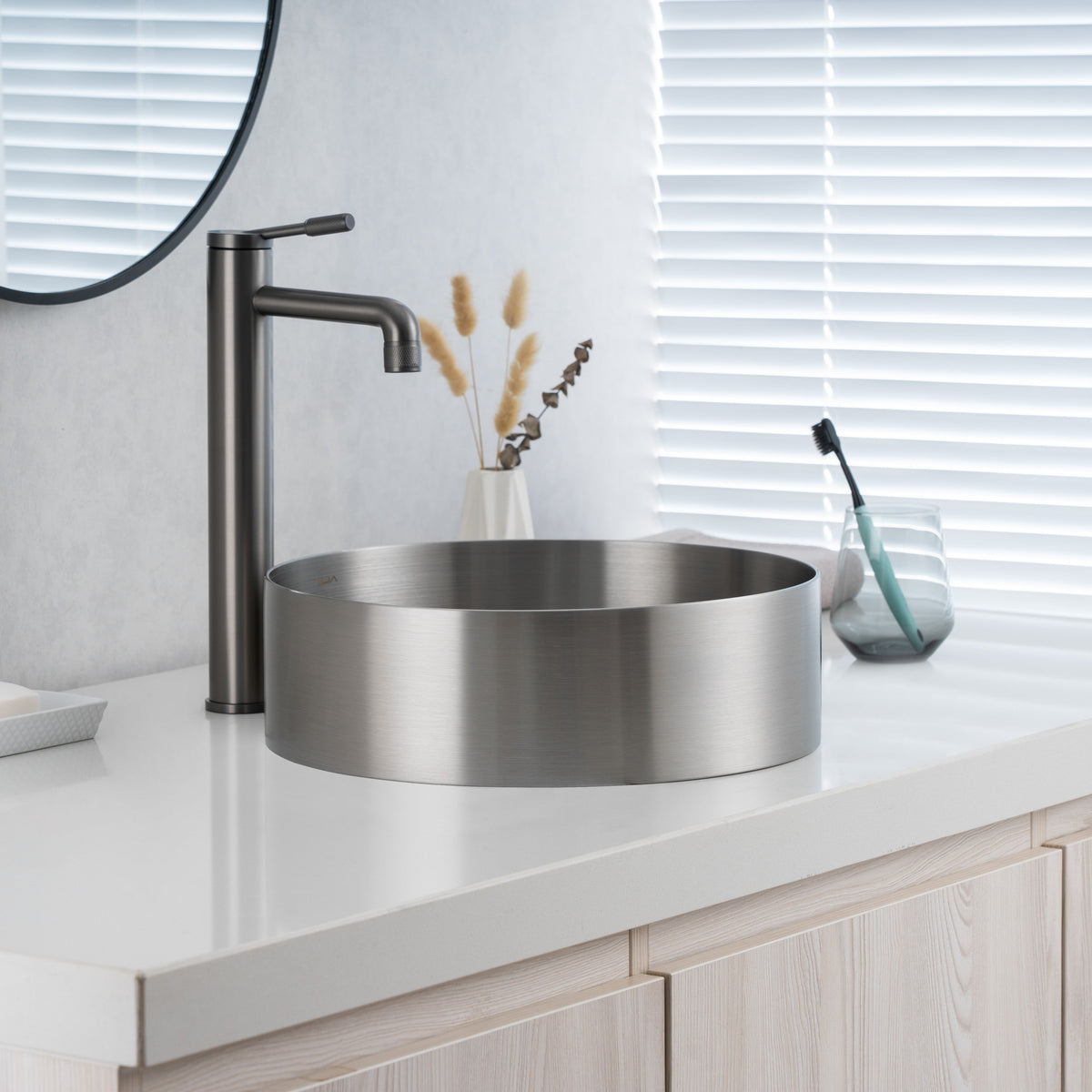 Close-up of installed ALIA brushed silver stainless steel sink showing its brushed texture and contemporary appeal.
