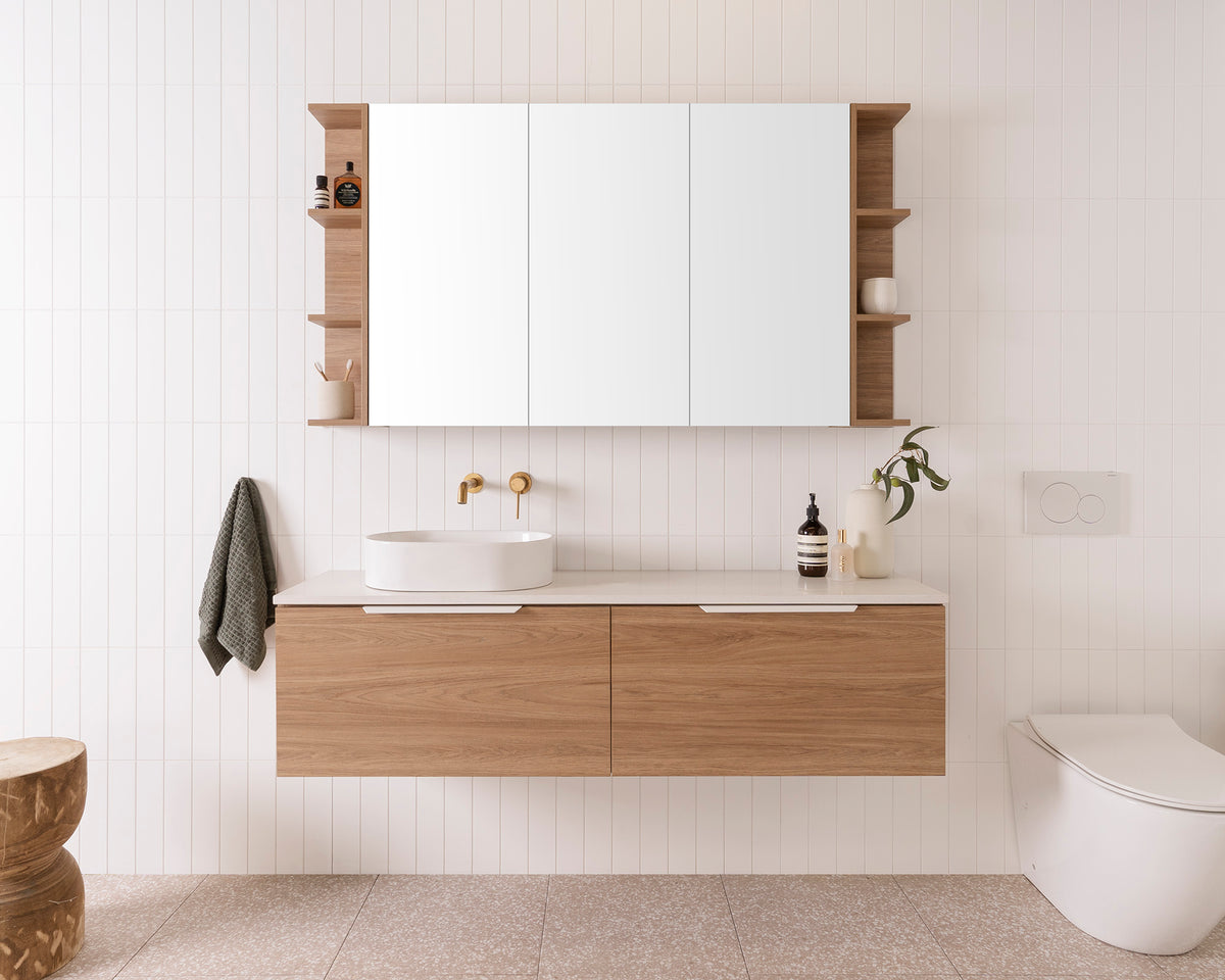 Glacier Pro Ensuite, All-Drawer, Slim 1500, Left Hand Bowl. Prime Oak Woodmatt cabinet finish with Matte White Blaze Handles. 20mm Organic White Caesarstone benchtop and Patty Above-Counter basin. Glacier Pro Shelf Mirrored Cabinet, 1500 3 door.