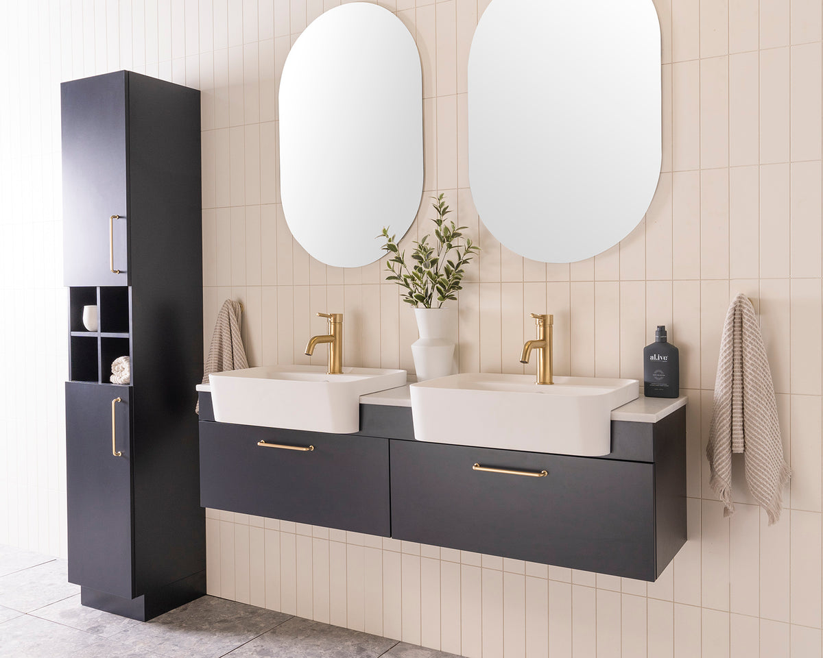 Glacier Semi-Recessed All-Drawer, Slim 1500 Double Bowl. Oxford Silk Matte cabinet finish with Brushed Brass Stirling handles. 20mm Carrera Cherry Pie benchtop and Miya 550 Semi-Recessed basins. Glacier Shelf Tallboy, Floor Mount.