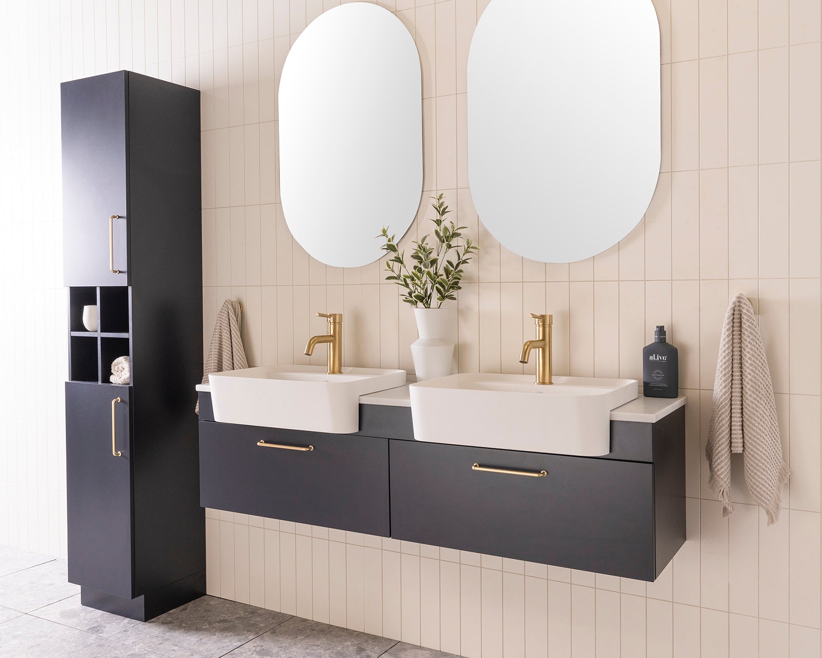 Glacier Semi-Recessed All-Drawer, Slim 1500 Double Bowl. Oxford Silk Matte cabinet finish with Brushed Brass Stirling handles. 20mm Carrera Cherry Pie benchtop and Miya 550 Semi-Recessed basins. Glacier Shelf Tallboy, Floor Mount.