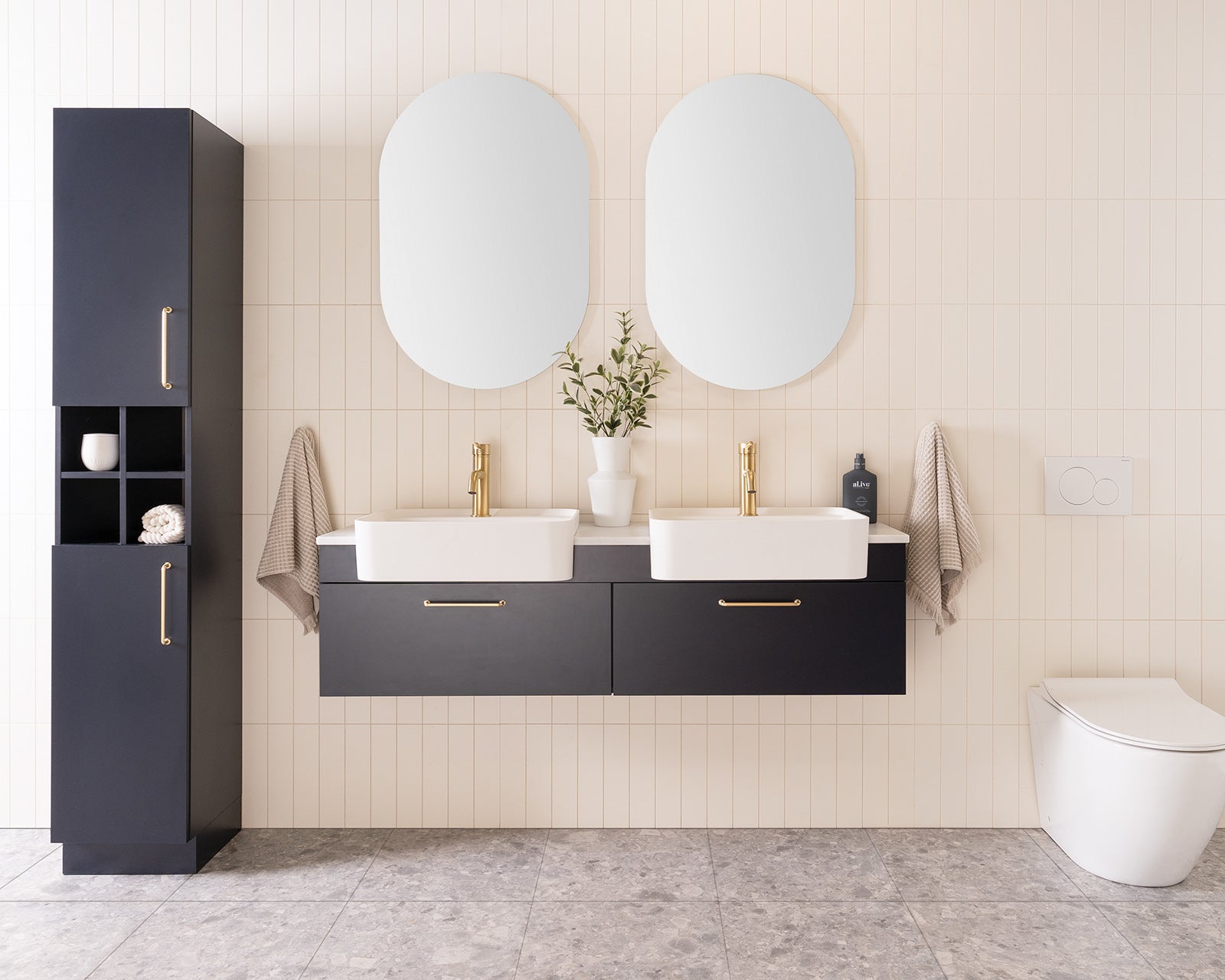 Glacier Semi-Recessed All-Drawer, Slim 1500 Double Bowl. Oxford Silk Matte cabinet finish with Brushed Brass Stirling handles. 20mm Carrera Cherry Pie benchtop and Miya 550 Semi-Recessed basins. Glacier Shelf Tallboy, Floor Mount.